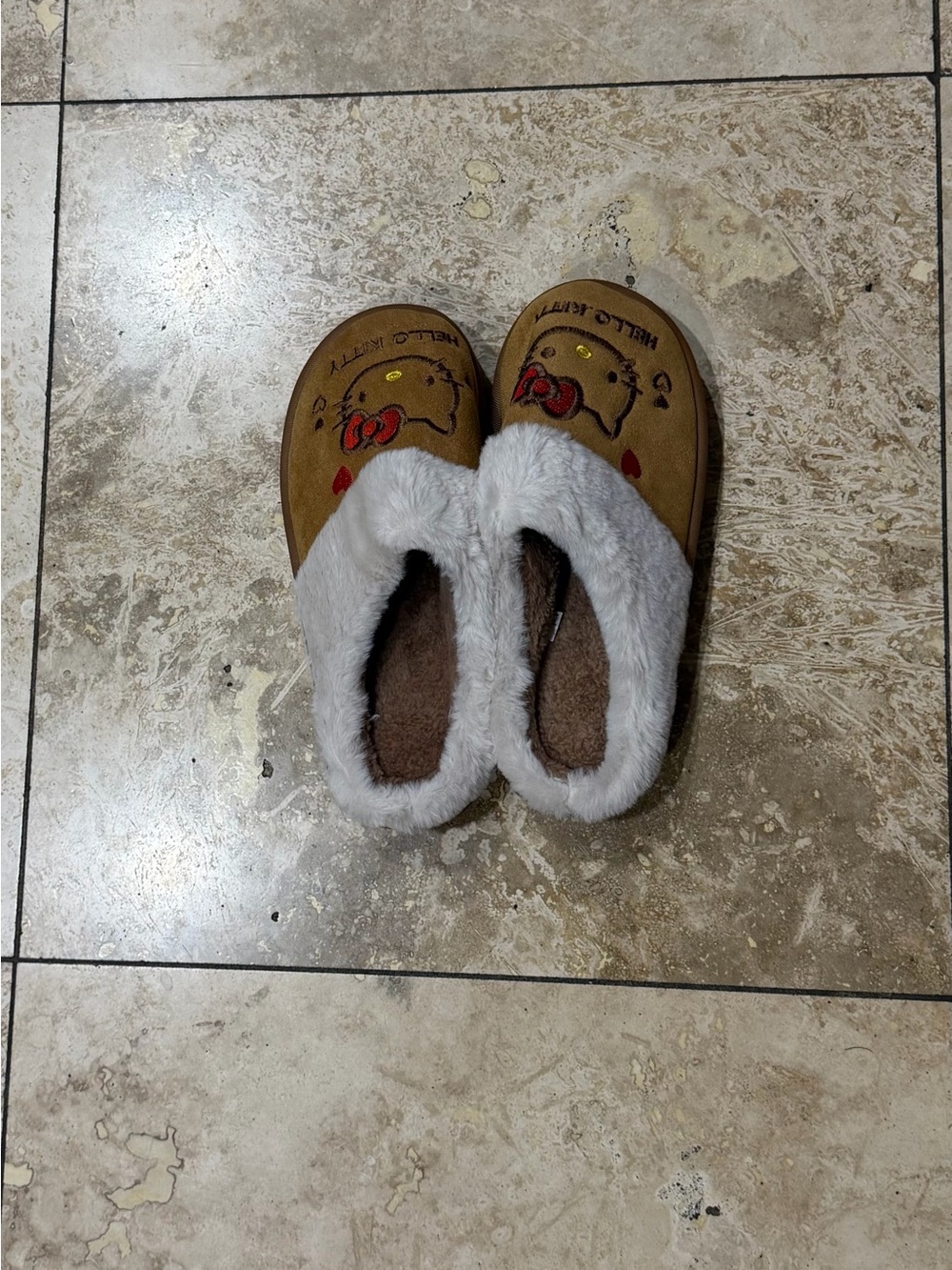 Hello Kitty Brown Slippers with White Fur Trim and Red Accents